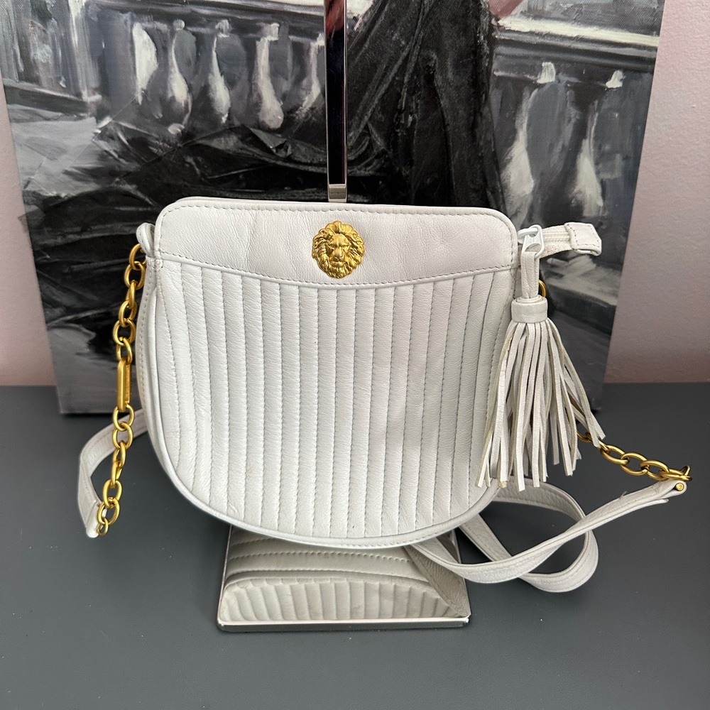 This bag is so pretty and elegant. On the back side there is a small scratch.